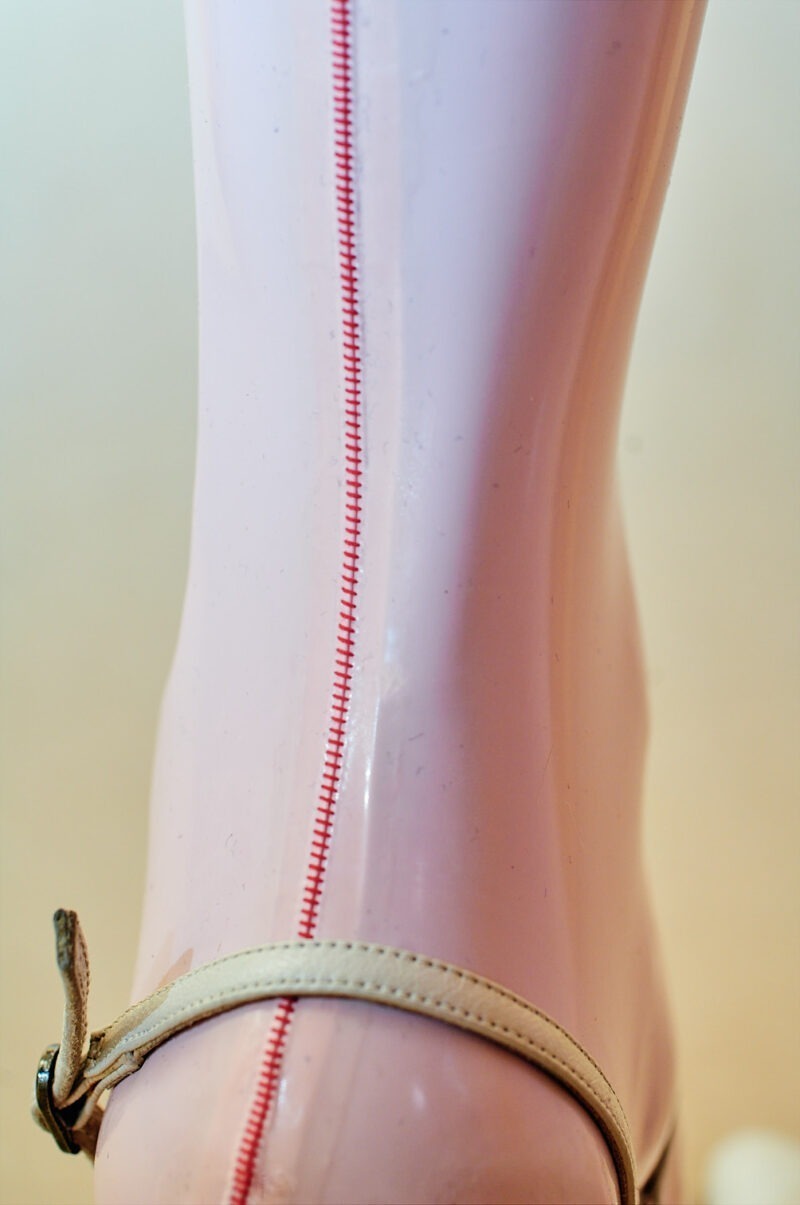 Red seamline at 0,2 mm pink latex stockings.This seam was made with an genuine nylon stockings sew machine med in the 50th
