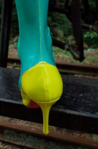 slim ankle and green latex stockings The yellow seamline of our real seamed latex stockings. The latex stocking are jade green and the high heels are yellow